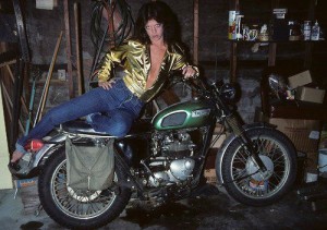 Jackie Fox lookin hot in her garage on a Triumph