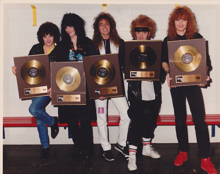 Autograph receiving their gold awards for SIGN IN PLEASE : Legendary Rock  Interviews