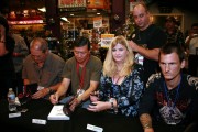 Producer Mike Clink, photographer Jack Lue and Vicky with the entire RECKLESS ROAD book panel